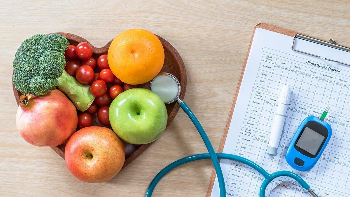 Critical illness cover need represented by healthy fruit and veg in a bowl.