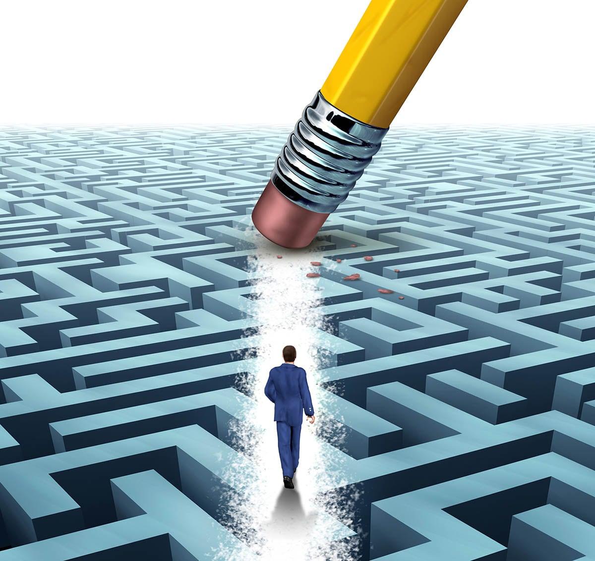 Pencil rubber over a maze representing the maze of the specialist buy-to-let market.