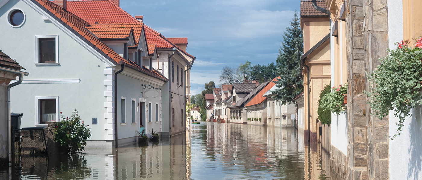 A flooded street illustrating the need for home Insurance. If you need buildings and contents insurance - we read the small print.